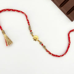 OM ON LOTUS RAKHI